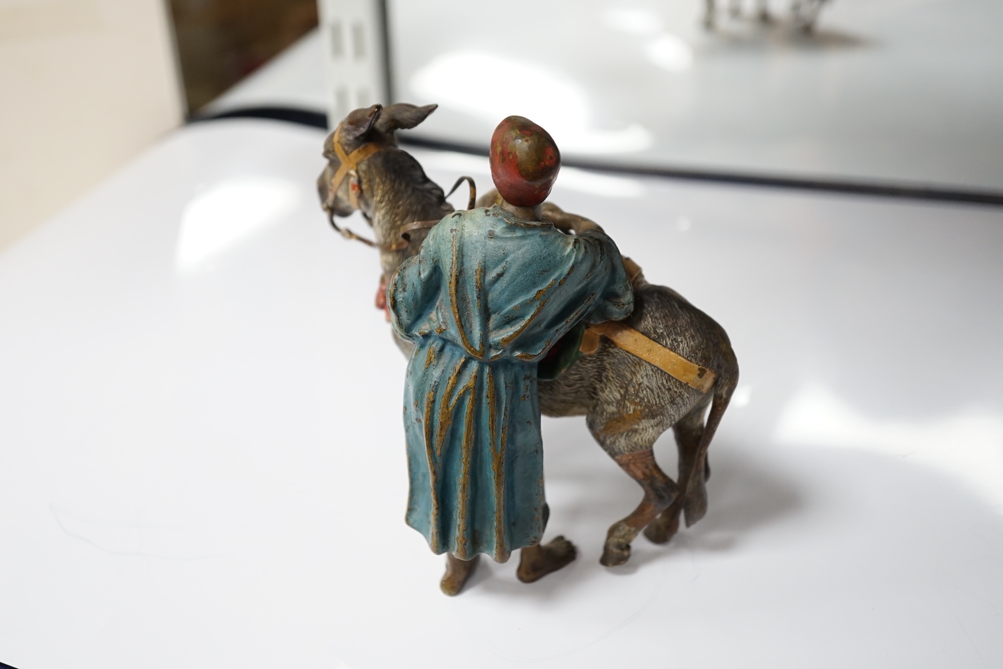 A Viennese cold painted bronze of an Arab trader with mule, 14cm high, 13cm wide. Condition - slight chipping to painted areas